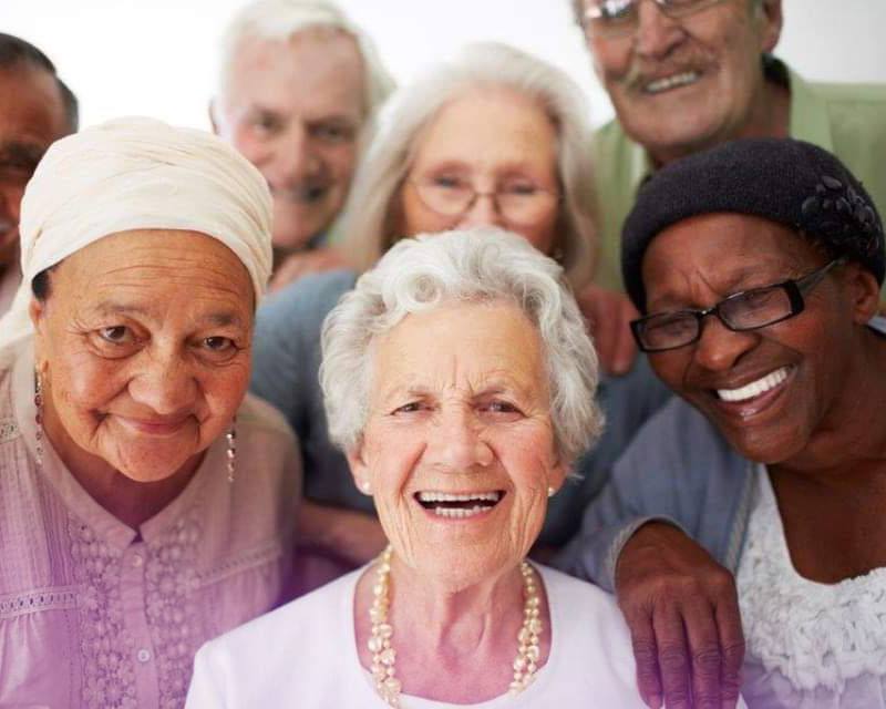 group of older people smiling together