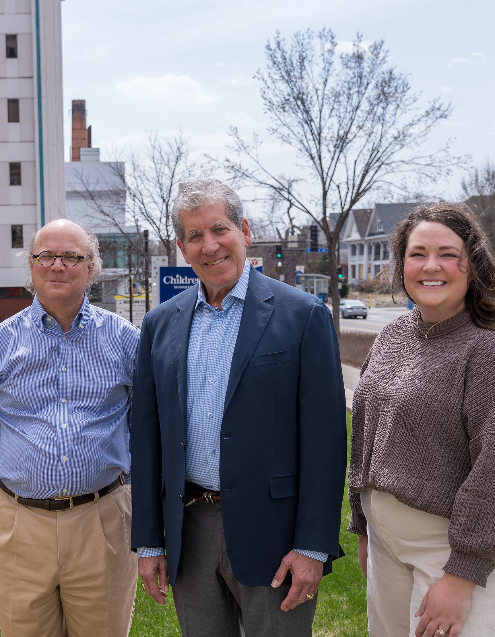 Two Foundation philanthropic advisors standing with a wealth advisor